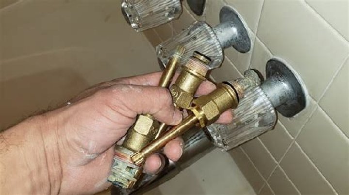 Can a diverter valve be replaced in a three handle shower?