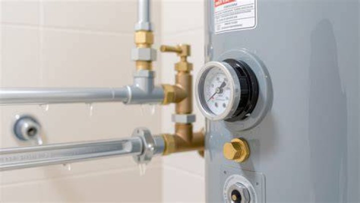 Can an old water heater cause low water pressure?