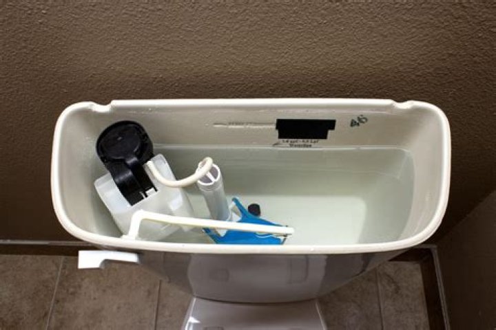 Can I add water to the toilet tank?