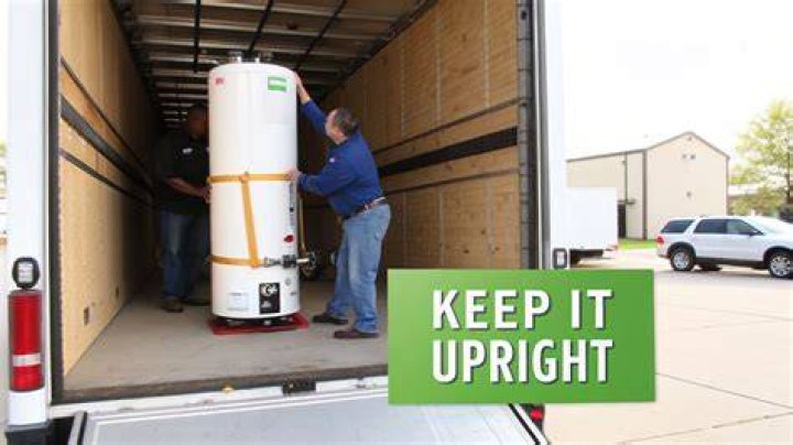 Can I lay a water heater on its side to transport?