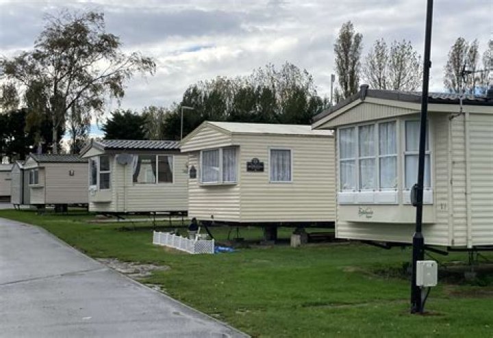 How are caravan parks regulated in the UK?