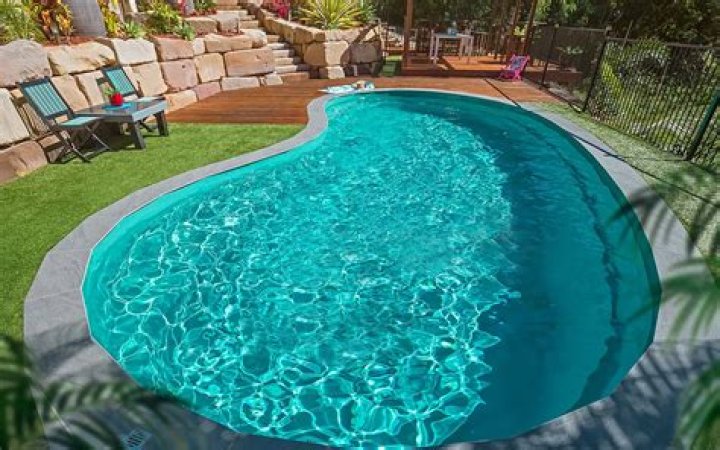 How big is a kidney shaped swimming pool?