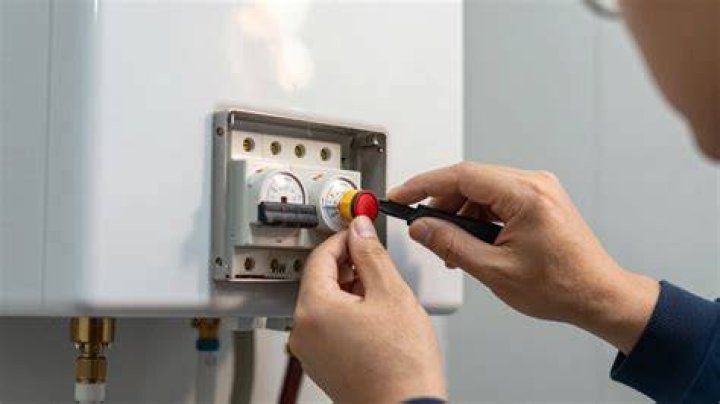 How do I reset my automatic hot water heater?