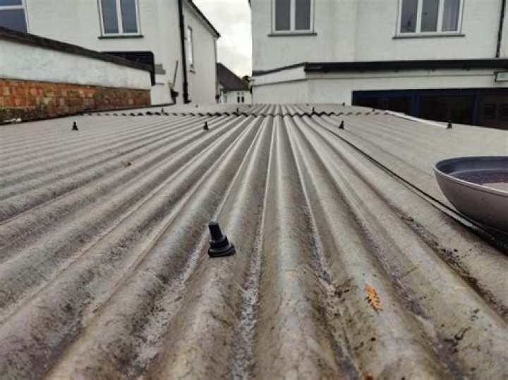 How do I stop water running back under corrugated roof?