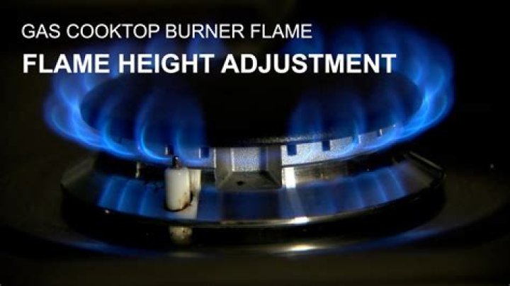 How do you adjust a gas stove burner?