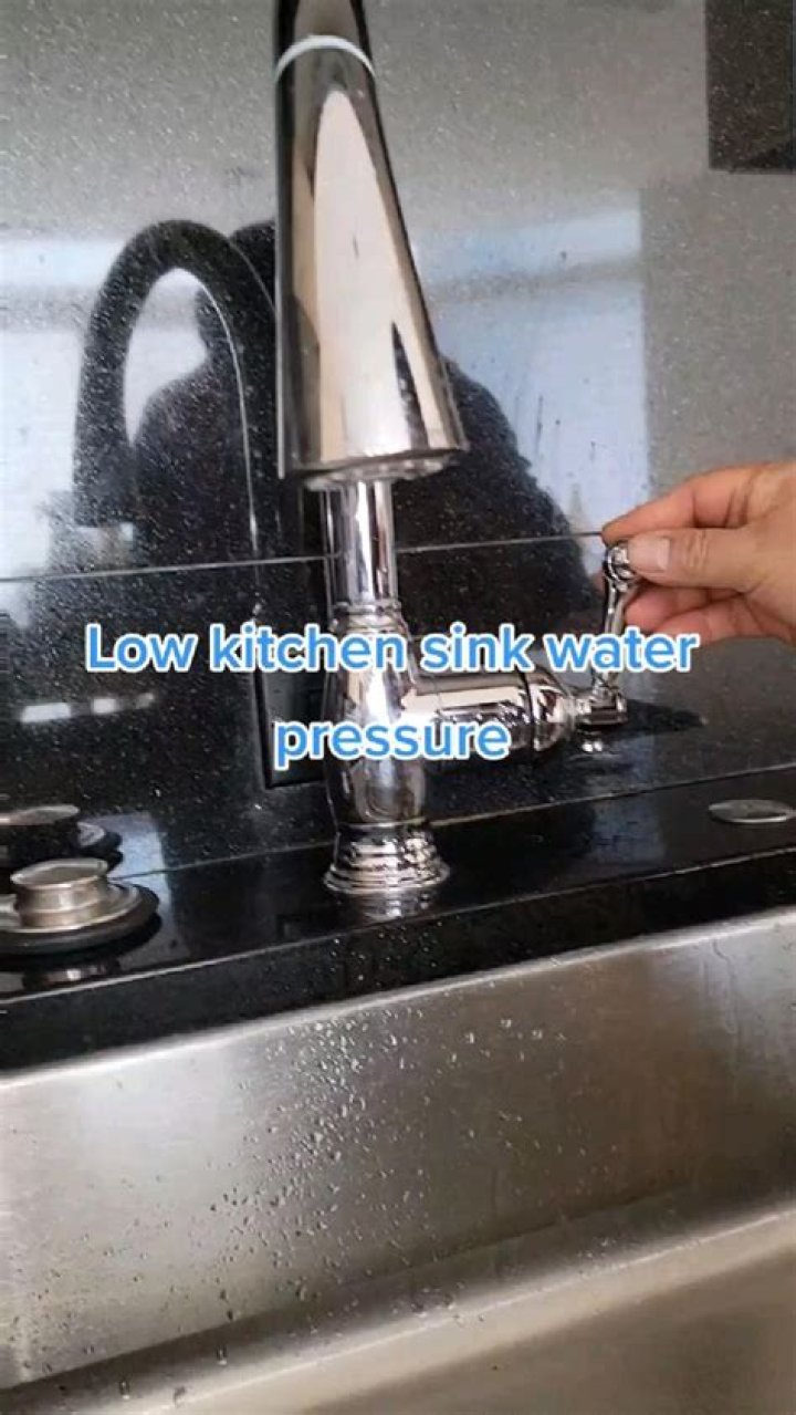 How do you adjust the pressure on a kitchen faucet?
