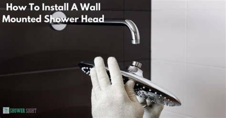 How do you change a shower head mounted to a wall?