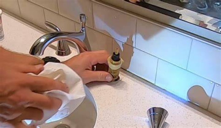How do you clean a Kohler fitting?