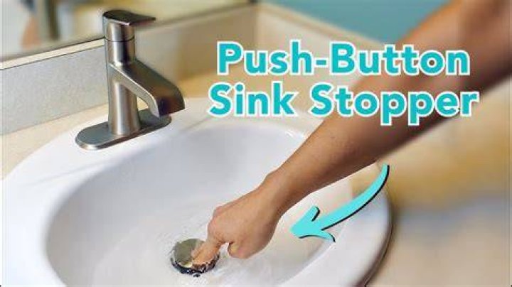 How do you clean a pop-up sink drain?