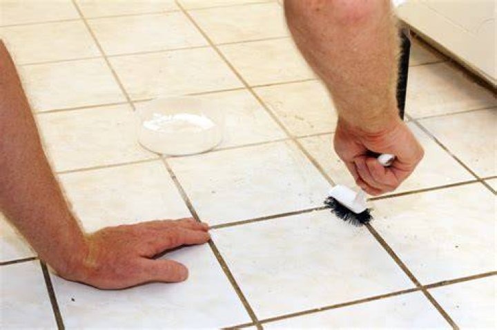 How do you clean black grout?