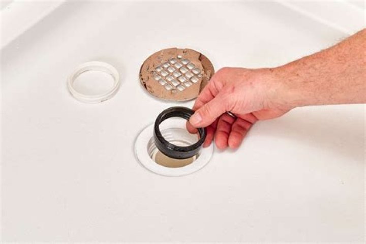 How do you drain water from a shower floor?