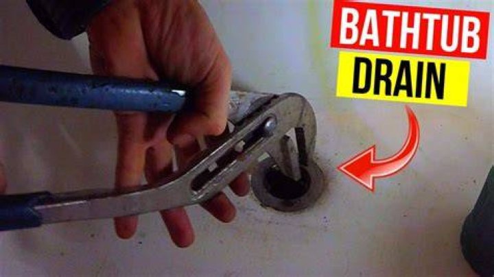 How do you get a stuck drain plug out of a bathtub?
