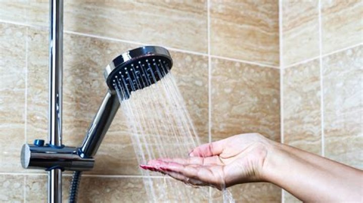 How do you keep water from changing temperature in the shower?