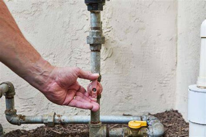 How do you loosen a stuck gas fitting?