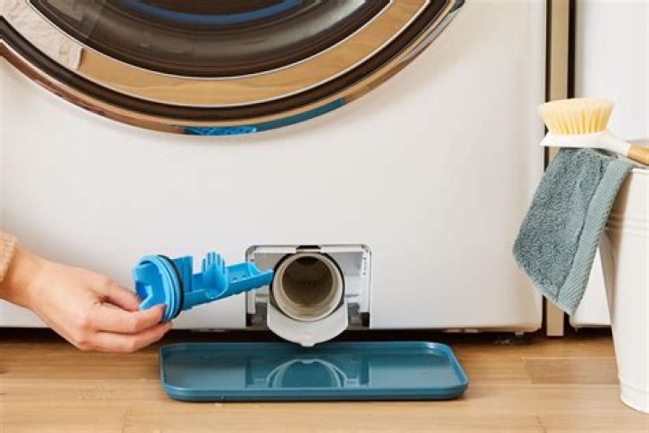 How do you open and drain a washing machine?
