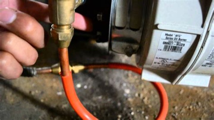 How do you prime and reset an oil furnace?