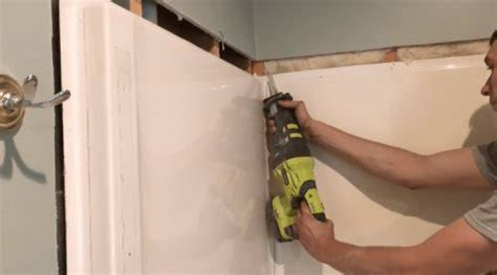 How do you remove a fiberglass shower enclosure?