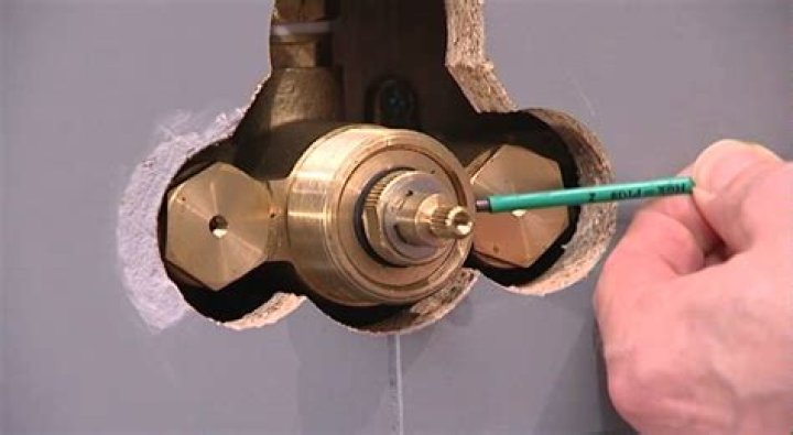 How do you remove a Grohe shower thermostat?