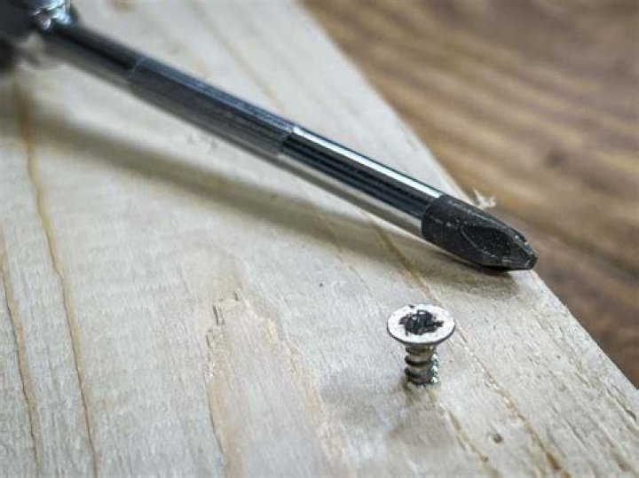 How do you remove a screw that has lost its grip?