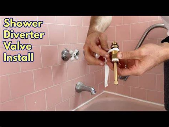 How do you remove a shower diverter cover?