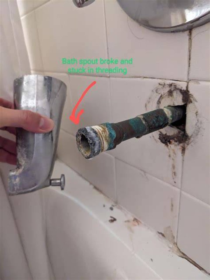 How do you remove a stuck tub spout adapter?