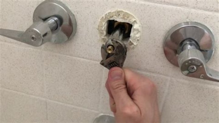 How do you replace a shower diverter knob?