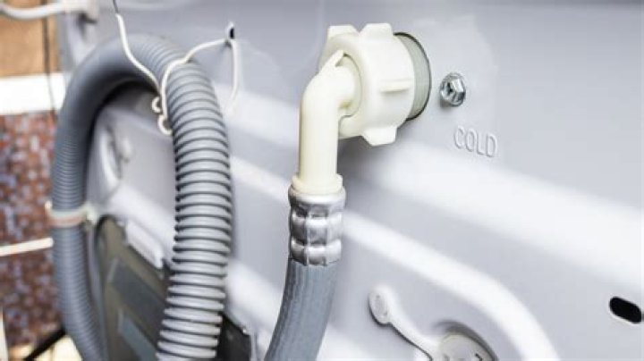 How do you restrict a washing machine drain hose?