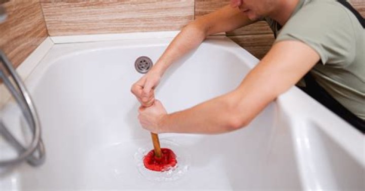 How do you stop a bathtub draining slowly?