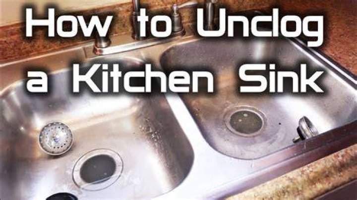 How do you unplug a double kitchen sink?