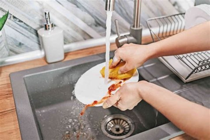 How do you wash dishes in a double sink?