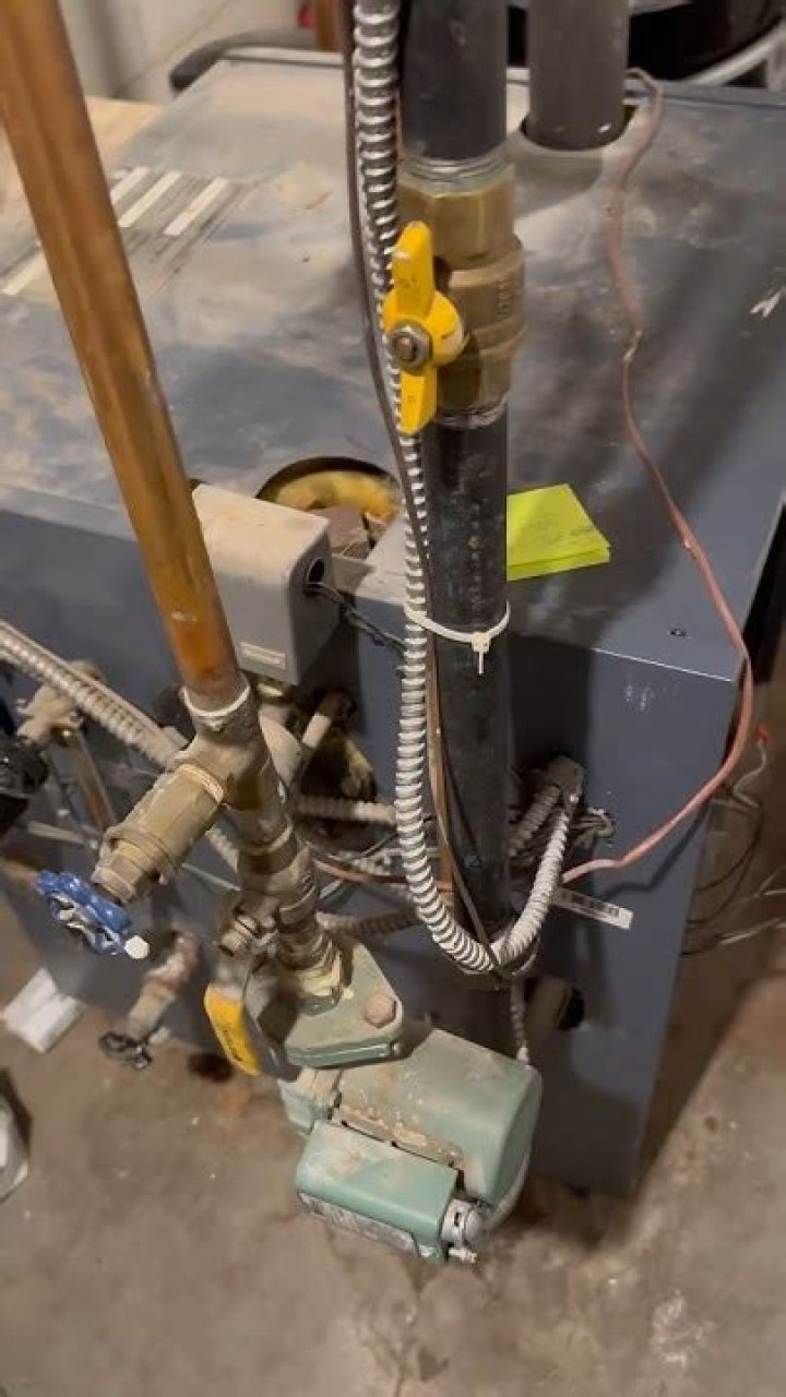How does a thermocouple work on a Weil-McLain boiler?