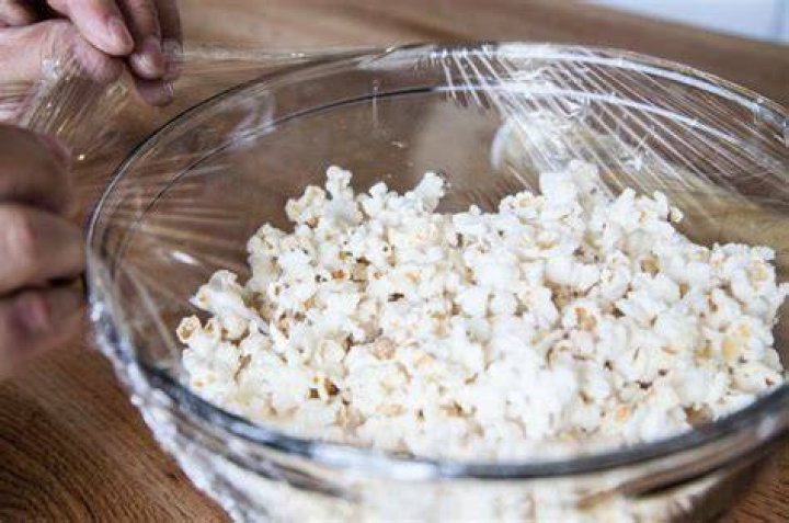 Is it OK to warm up popped popcorn?