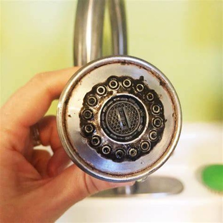 What causes black sludge in faucet?
