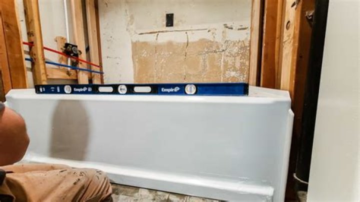 What do you put under a tub to level it?