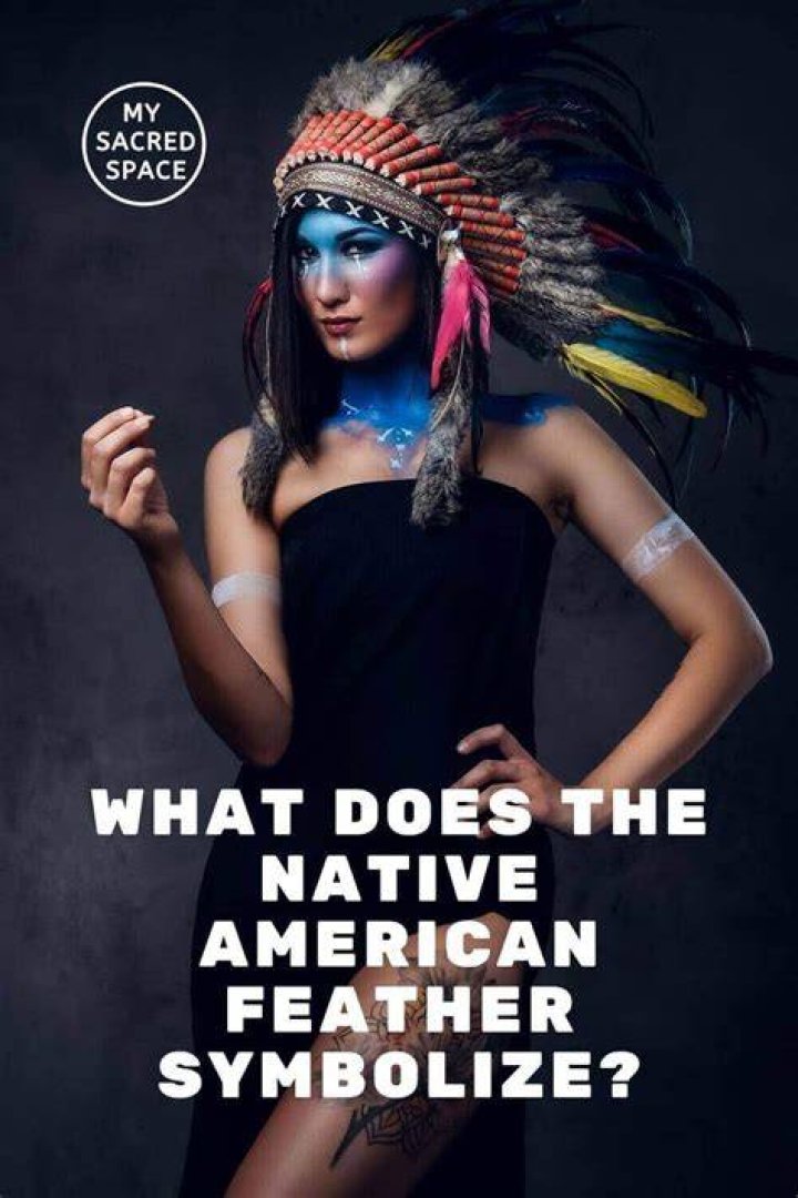 What does a feather headdress symbolize?