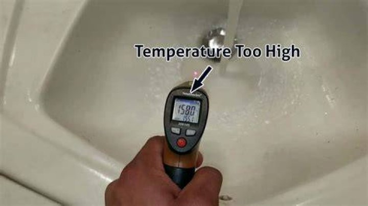 What happens if the thermostat is set too high on a water heater?