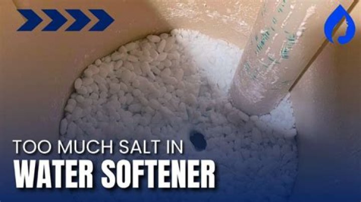 What happens if there is too much salt in the water softener tank?