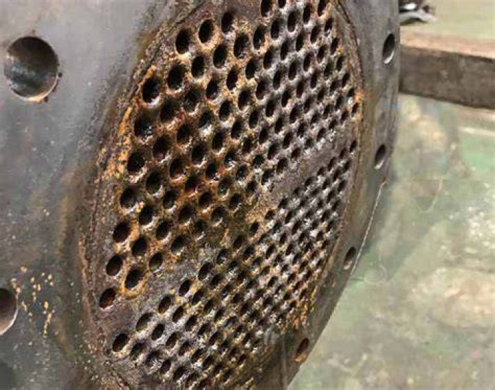 What is a likely cause of a tube leak in a heat exchanger?