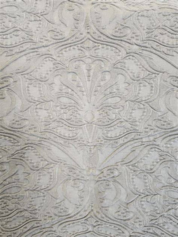 What is fabric with a raised pattern called?