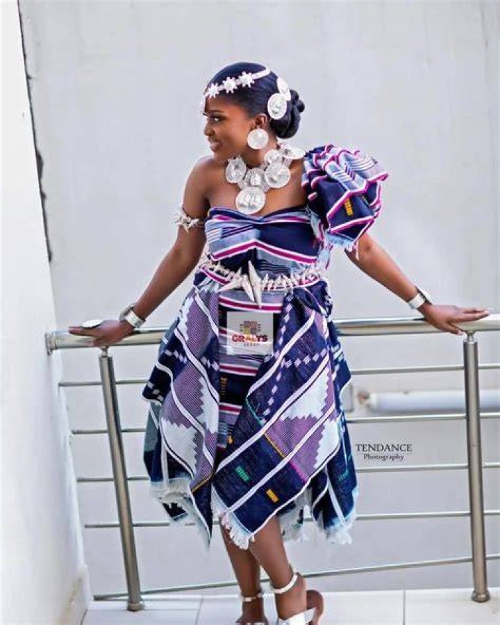 What is the traditional attire of the Ewe?