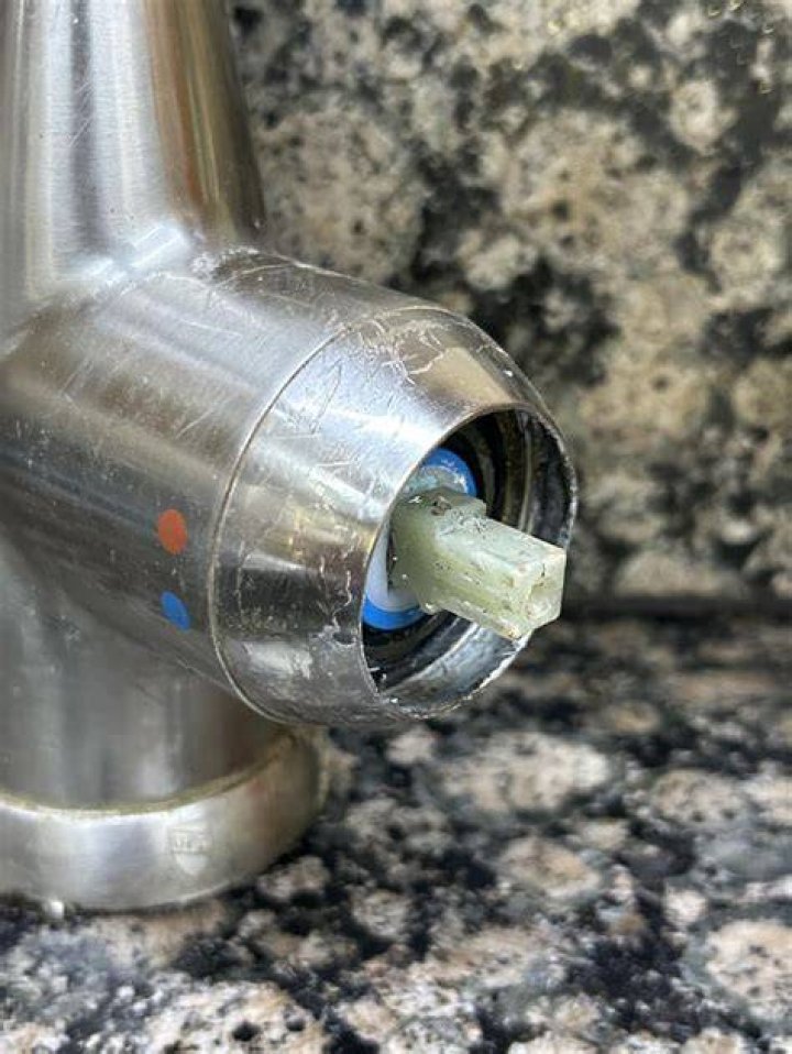 What should I do if my faucet cap is stuck?