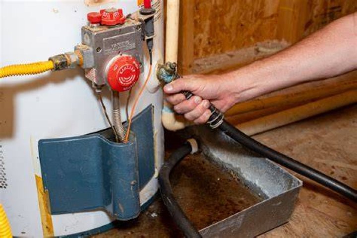 What should I do if my hot water heater starts to drain?