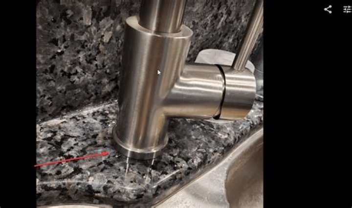 What should I do if water gets under my new faucet?