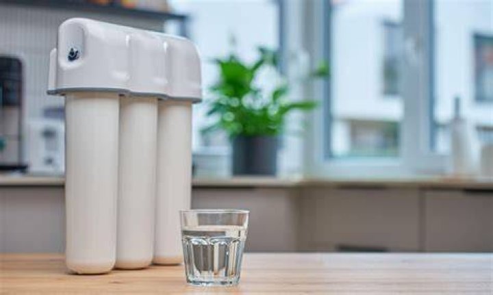 When should I replace my water dispenser filter?