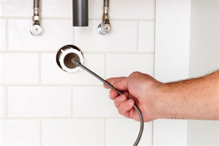 Which way do you turn a plumbing snake?