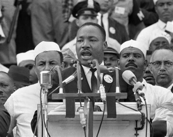 Who were the men in white hats behind MLK?