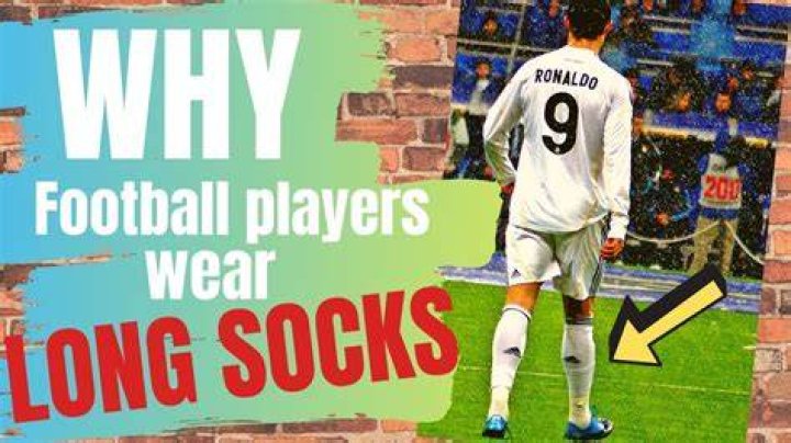 Why do footballers pull their socks up over their knees?
