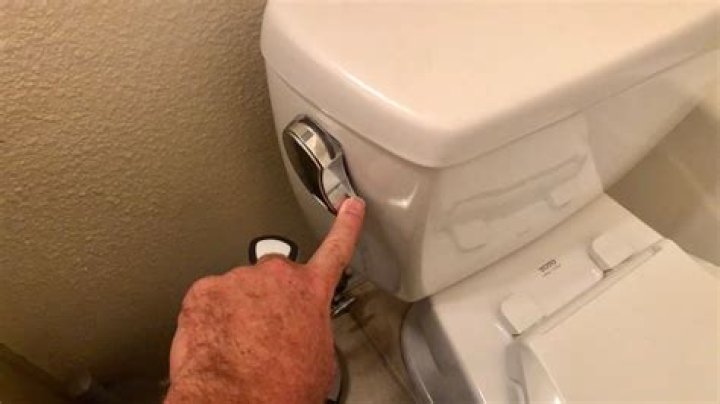 Why do I have to hold down my toilet handle?