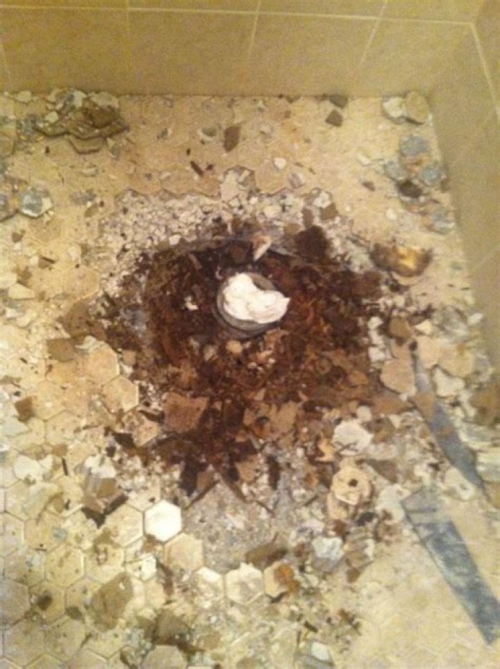 Why do shower failure occur in 75% of tiled showers?