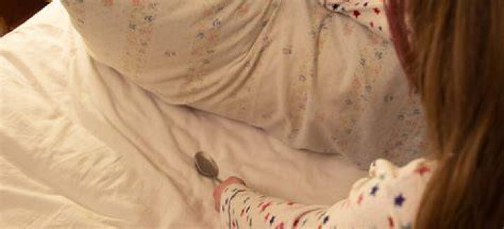 Why do you put a spoon under your pillow for a snow day?